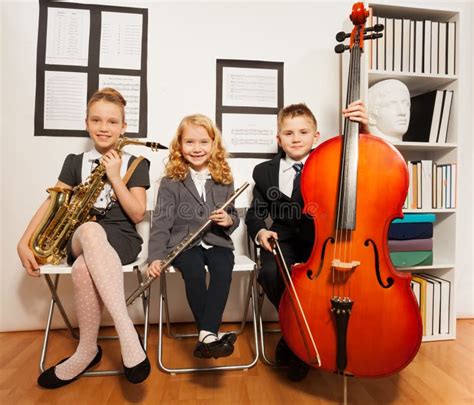 Happy Group Of Kids Playing Musical Instruments Stock Photo Image Of