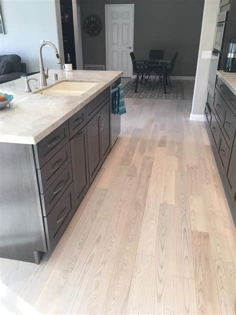 White ash wood flooring is available in either pale grey or light tan colors at $9 to $13 per square foot. 3/4" x 5" Matte Carriage House White Ash - BELLAWOOD ...
