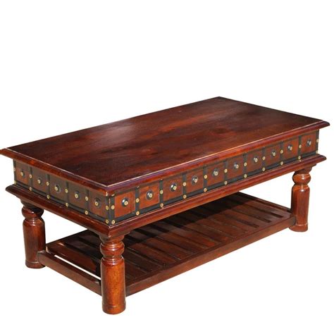 This mango coffee table has a distinctive industrial feel that will fit seamlessly into your living room. Colonial Dutch Mango Wood 2-Tier Coffee Table