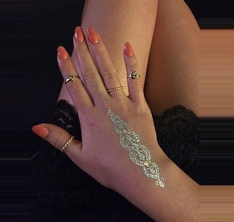 A henna tattoo is one of the exceptions to the standard scenario, and a beautiful one at that. Copy the look: Little Mix's Perrie rocks cute metallic ...