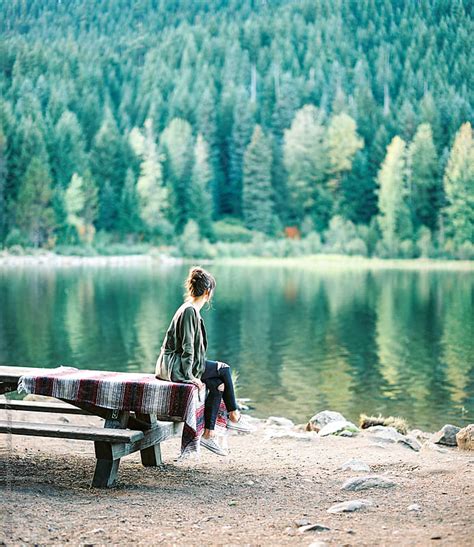 Girl Sitting On Picnic Table At Lake By Daniel Kim Photography