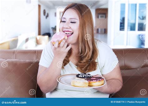 Obese Woman Eating Donut On Plate Stock Photo Image Of Junk Food