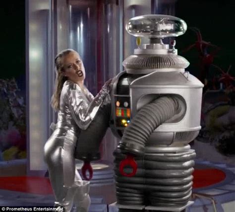 Kendra Wilkinson Squeezes Into Skintight Silver Spacesuit In Lost In