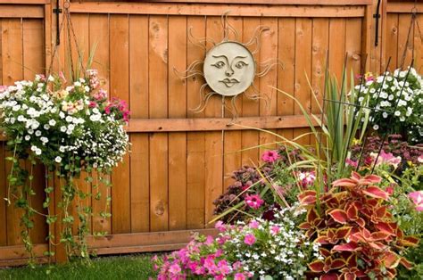 Metal bracket for hanging baskets. 27 Gorgeous Fence Planters | Garden Outline