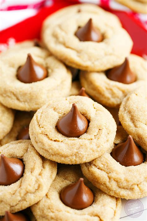 Hershey's kiss cookies are the perfect combo of chewy chocolate cookie and hershey kiss candies. Peanut Butter Blossom Cookies - Table for Two® by Julie ...