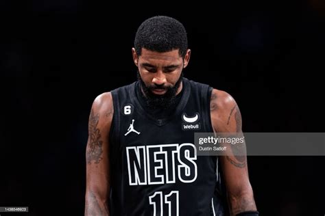Kyrie Irving Of The Brooklyn Nets Walks To The Bench During The News