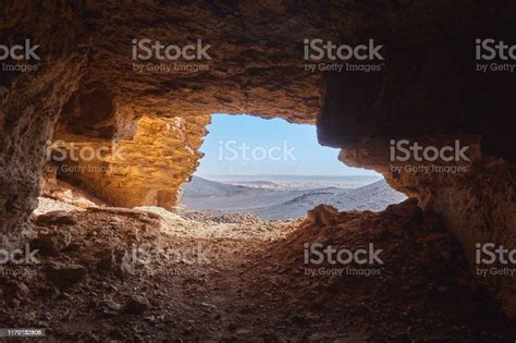 View From The Inside Of A Cave To The Rocky Desert In The Sahara In
