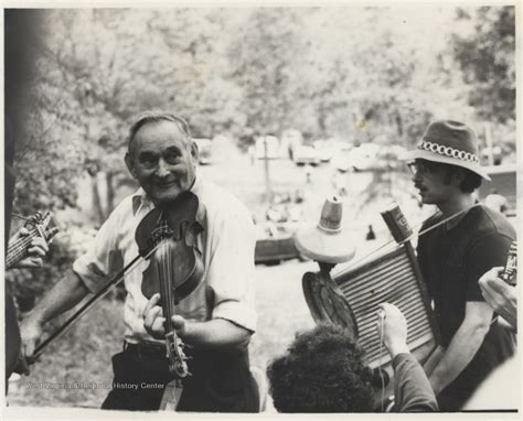 Musicians Playing A Fiddle And Washboard At An Appalachian Folk Music