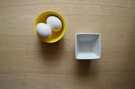 Two White Eggs In Yellow Ceramic Bowl · Free Stock Photo