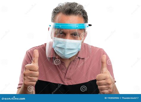 Man Wearing Screen And Mask Showing Thumbs Up Gesture Stock Photo