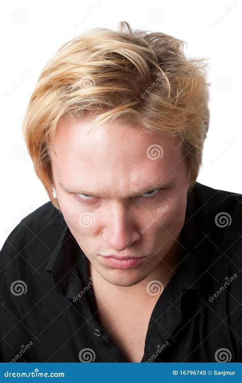 Mean Young Boy Looking At High Angled Camera Royalty Free Stock Image