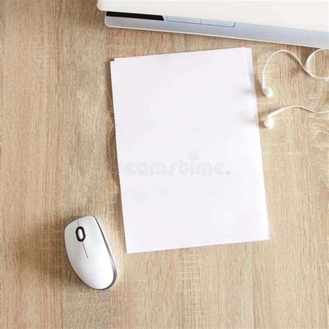 A4 Blank White Pperon Table With Laptop And Mouse Stock Photo Image