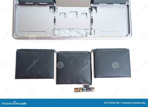 Swollen Laptop Battery Next To Disassembled Laptop Stock Photo Image