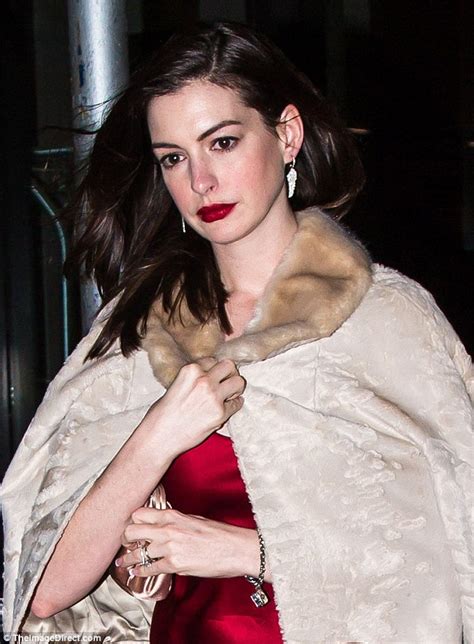 Anne Hathaway Stuns In Red Dress And Fur As She Heads Out For Birthday