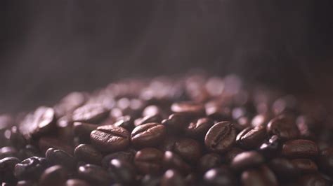 coffee beans roasting with smoke selective focus and soft focus 31728314 stock video at vecteezy