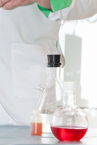 Transparent Laboratory Flasks With Multicolored Reagents Closeup