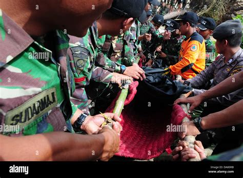 Aceh Indonesia 5th July 2013 Indonesia Military Carry A Victim Body By An Earthquake In