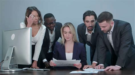 Group Of Business People Busy Discussing Financial Matter During