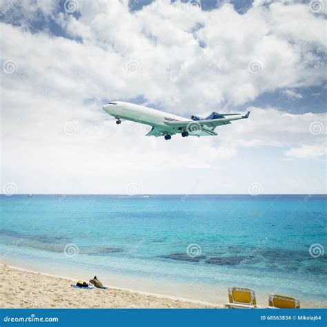 Plane Landing Over Maho Beach In Saint Martin Island Stock Photo