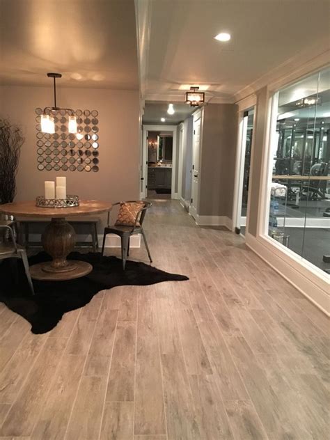These choices require minimal space and are perfect for newer homes where you can attach a ceiling directly to the support. Basement Flooring Ideas. Flooring: Thomas Tile Faux Wood ...