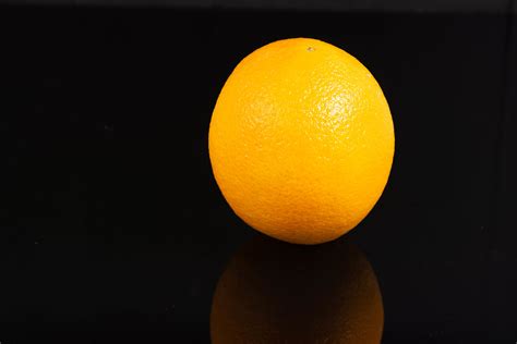 Whole Orange Fruit Above Reflective Black Background Creative Commons
