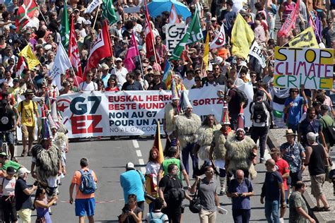 thousands-join-protest-march-as-world-leaders-arrive-in-france-for-g7