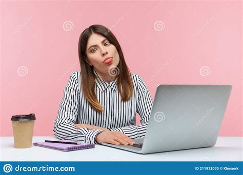 Exhausted Funny Woman Fooling Around Crossing Eyes And Showing Tongue Pretending To Be Dumb And