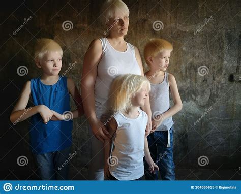 Three Blonde Brothers Pose In Studio Next To Their Mother Boys And A