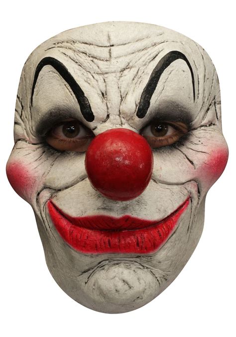 The Clown Mask Is White With Red Nose And Black Eyebrows It Looks Like
