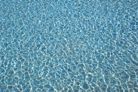 Swimming Pool Water Background With Texture Of Water Surface With