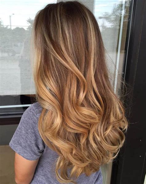 Here different shades of caramel dye have been used right from near the roots and the highlight becomes more subtle towards the end. 22 Auburn Hair Color Ideas for Women