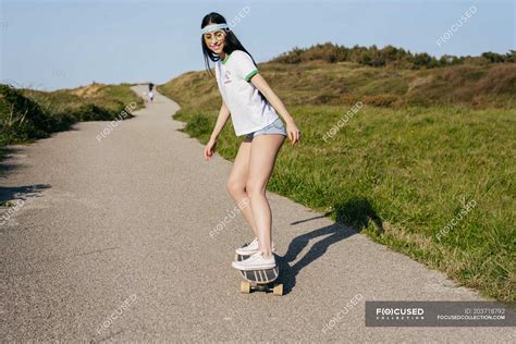 Teenage Girl Riding Skateboard — Relaxation Horizontal Stock Photo