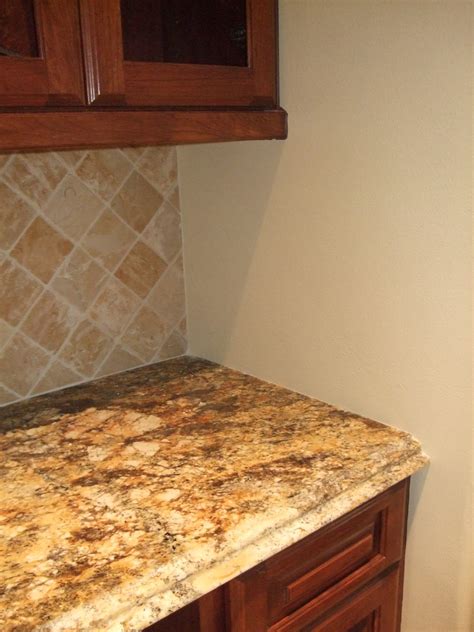 You could stop the backsplash where the upper cabinets end, but we usually recommend lining up with the base cabinets. design in wood: Backsplash Tips - Don't Do This!