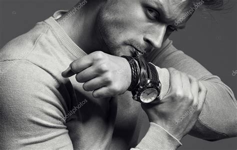 advertising wrist watch concept beautiful handsome muscular male model with perfect body in