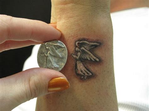 Small Flying Angel Tattoo On Wrist Small Angel Tattoo Small Tattoos