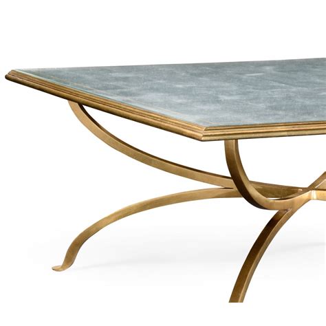 A feature that most lends itself to rustic and global coffee tables, we love a table that can help keep little messy secrets, just that—secret. French Glass Square Coffee Table, Gold | Swanky Interiors