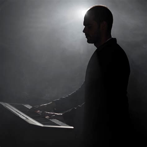 Free Photo Artist Playing Piano Smoke And Shadows Effects