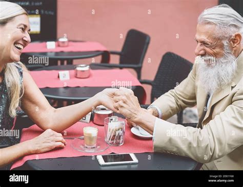 Happy Senior Couple Drinking Coffee In Bar Outdoor Fashion Mature
