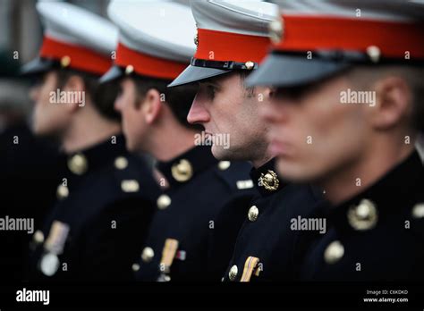 Royal Marines In Dress Uniform Amongst Mourners Gathered For A