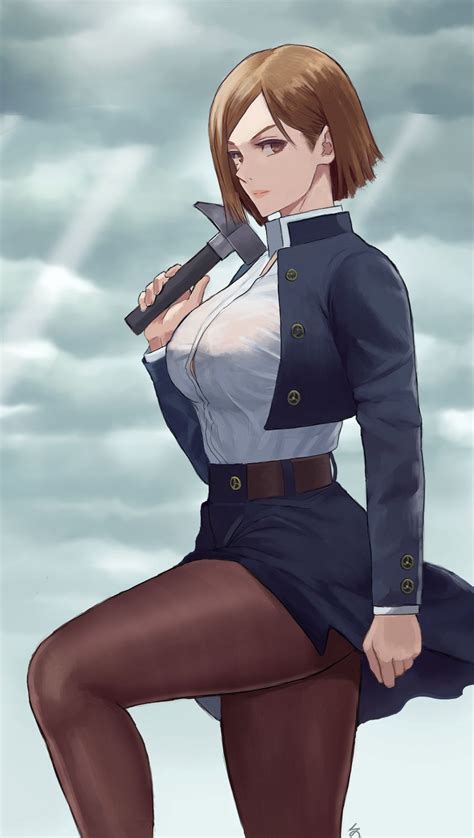 A Woman In Uniform Holding A Knife And Posing For The Camera With