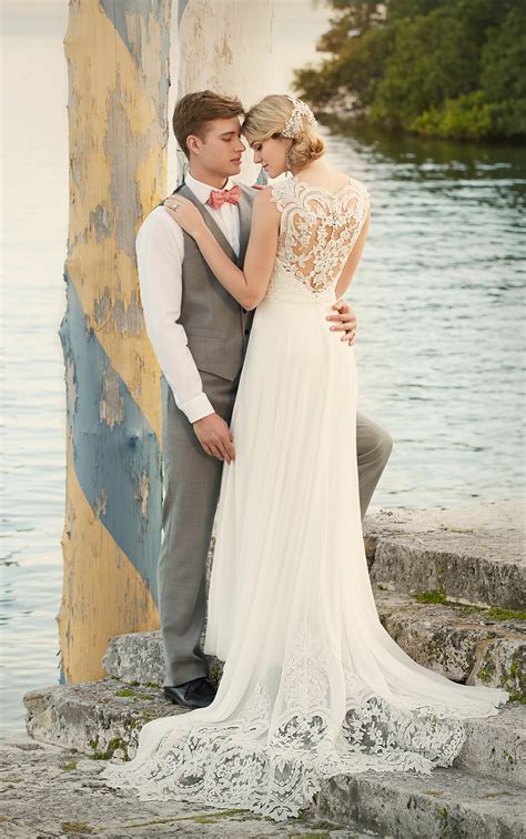 Have one of the groomsmen with their trousers rolled up ankle deep in the sea, or the bride and groom's wedding shoes at the waters edge. Designer Beach Wedding Dress | Wedding Dresses | Essense ...