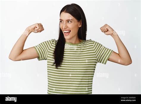 Empowered Happy Woman Feeling Strong Flexing Biceps Showing Her