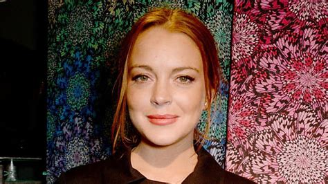 Lindsay Lohan Flaunts Her Enviable Figure In A Low Cut Bodysuit