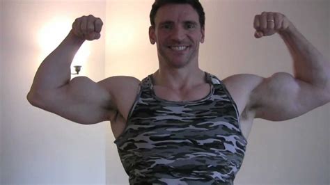 Posing And Flexing Biceps And Arms With Bodybuilder And Personal