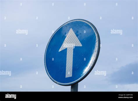 Proceed Straight Only Direction Sign On Cloudy Sky Background With Copy