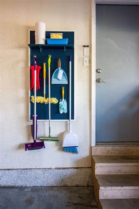 Go to 99pallets.com to see the diy! DIY Garage Pegboard Organizer For Brooms And Cleaning ...
