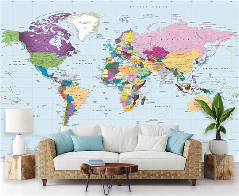 A Living Room With A Couch Table And Large Wall Map On The Wall Behind It