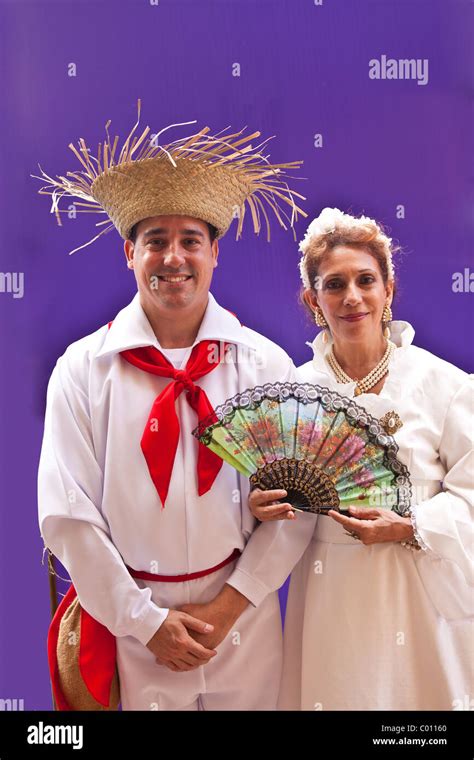 A Couple Dressed In Traditional Puerto Rican Costume At The Festival Of