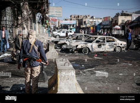 Sanaa Yemen 05th Dec 2017 A Houthi Rebel Fighter Stands Near Cars