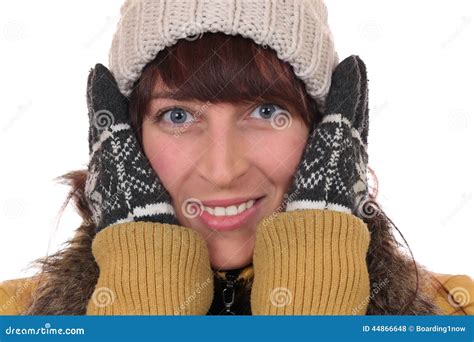 Portrait Of A Young Woman Freezing In The Cold In Winter Stock Photo